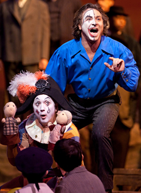 Tony Stevenson as Beppe and Roberto Alagna as Canio in PAGLIACCI; photo by Marty Sohl/Metropolitan Opera